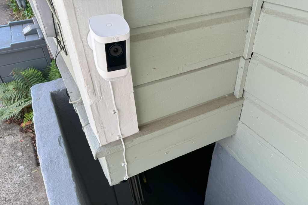 Ring Spotlight Cam Pro installed at an outdoor basement entrance